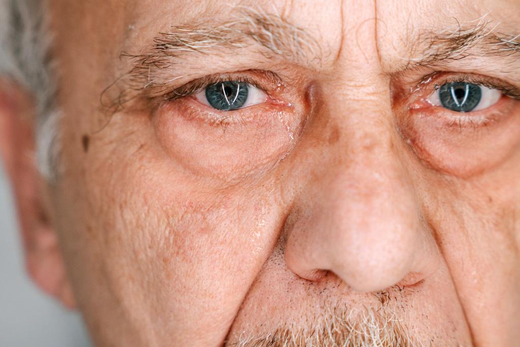 A zoom in on an elderly man's eyes.